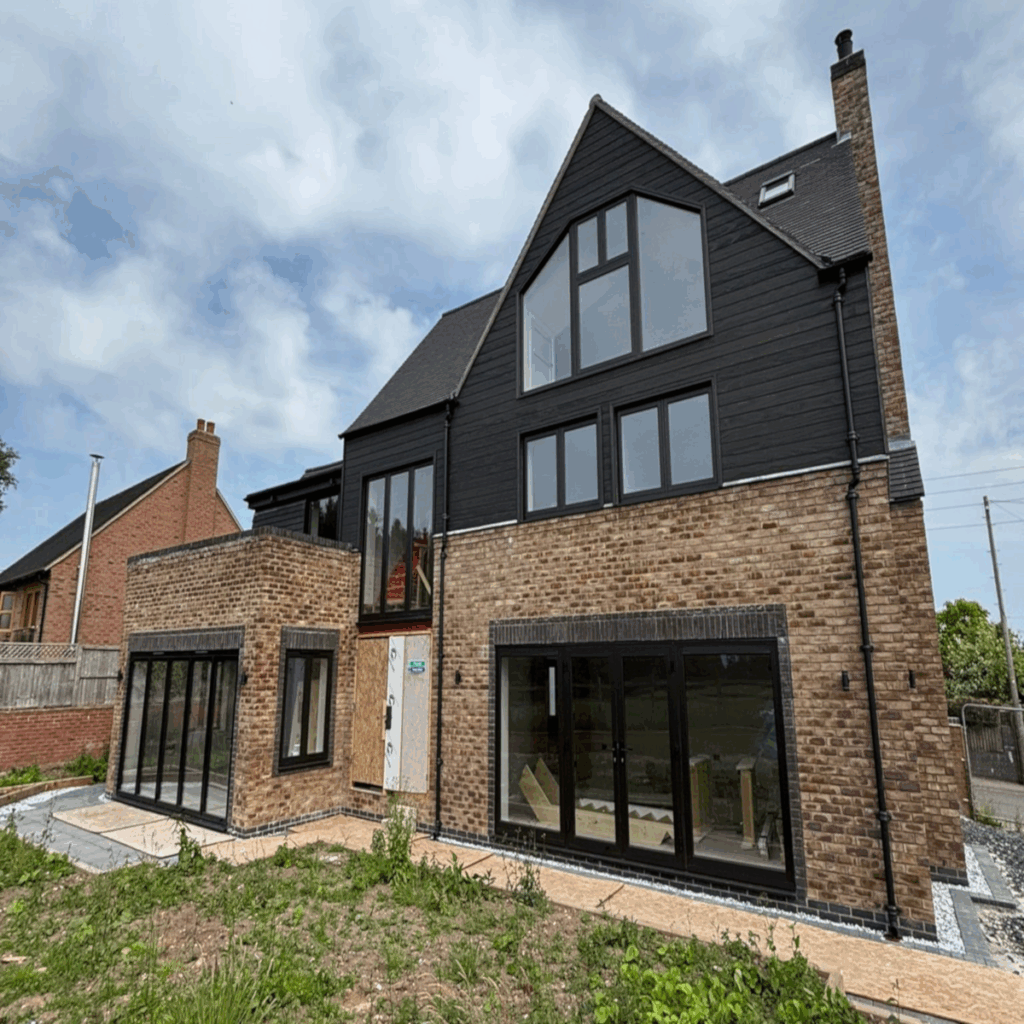 New build on brownfield site has air source heat pump as they are heavily favored over gas boilers for heating systems on new builds to meet low-carbon requirements.